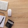 Business accounting workplace and stationary supplies on desk table background